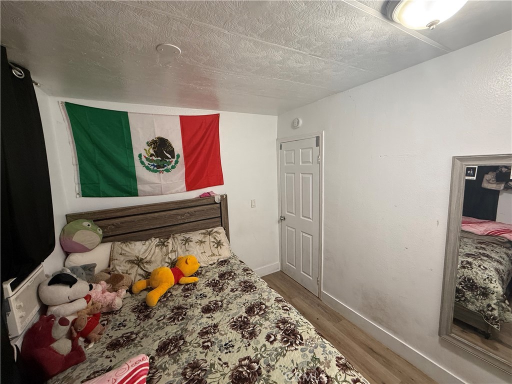 227 Palos Verdes Drive Santa Ana, CA 92704 - Photo 29 of 41 a room with toys and wooden floor