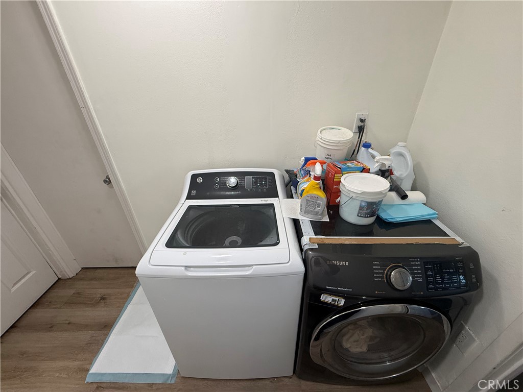227 Palos Verdes Drive Santa Ana, CA 92704 - Photo 30 of 41 a utility room with dryer washer and wooden floor