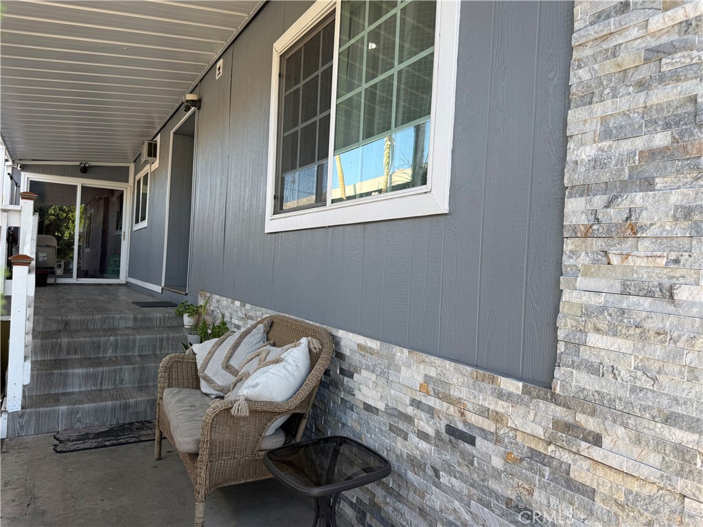 227 Palos Verdes Drive Santa Ana, CA 92704 - Photo 4 of 41 a outdoor living space with furniture and a window