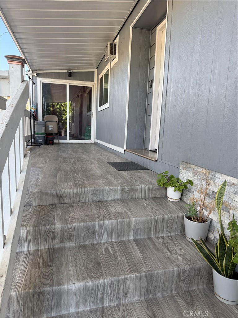 227 Palos Verdes Drive Santa Ana, CA 92704 - Photo 7 of 41 a hallway with table and chairs