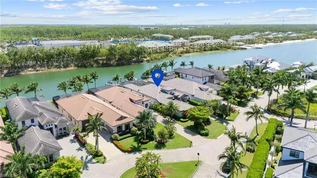 an aerial view of a house with a lake view