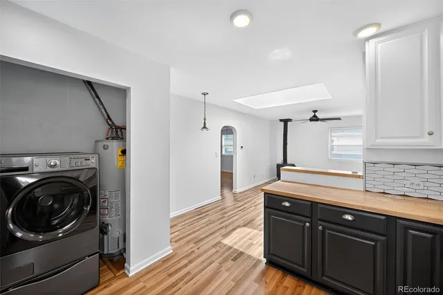 a kitchen with a sink and a washer dryer