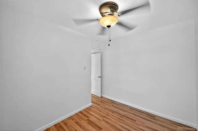 a view of room with wooden floor