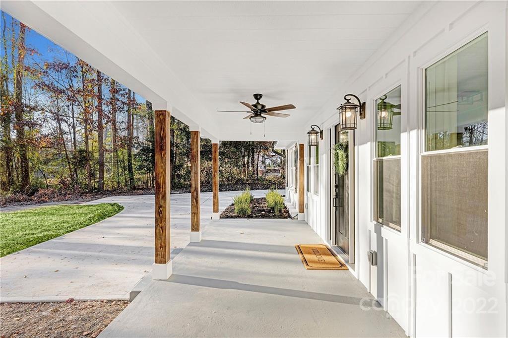 2606 Holbrook Road Fort Mill, SC 29715 - Photo 21 of 23 a view of a building with a floor to ceiling windows and a patio