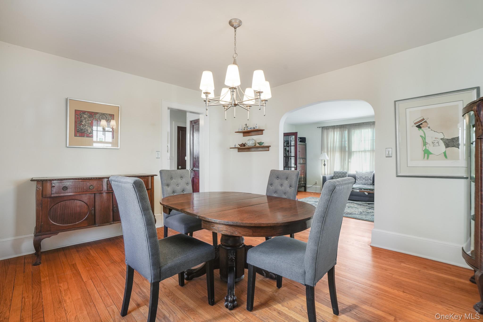 31 Wilson Boulevard Poughkeepsie, NY 12603 - Photo 13 of 36 a view of a dining room with furniture a chandelier and wooden floor