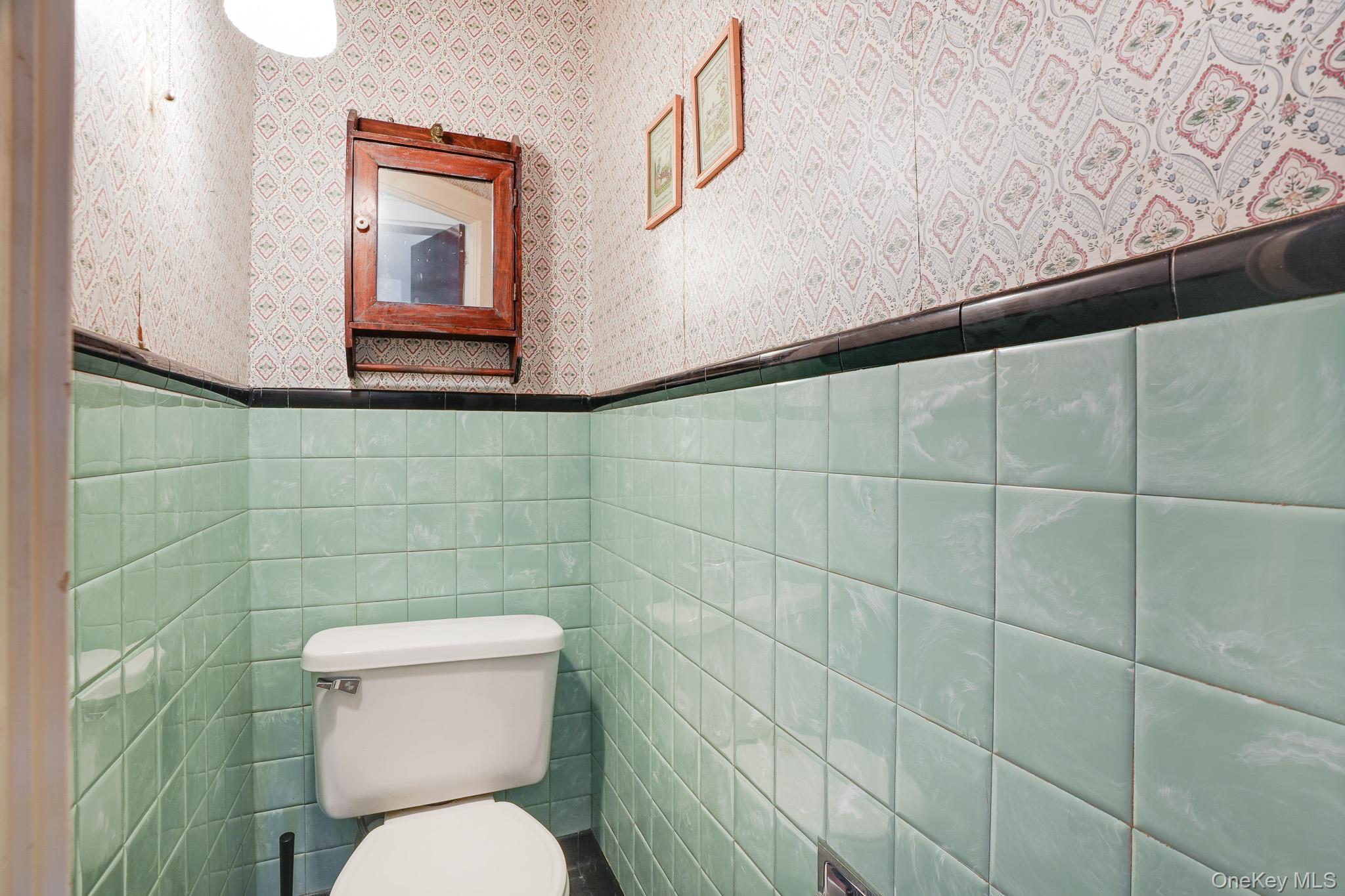 31 Wilson Boulevard Poughkeepsie, NY 12603 - Photo 15 of 36 a white toilet sitting next to a bathroom sink