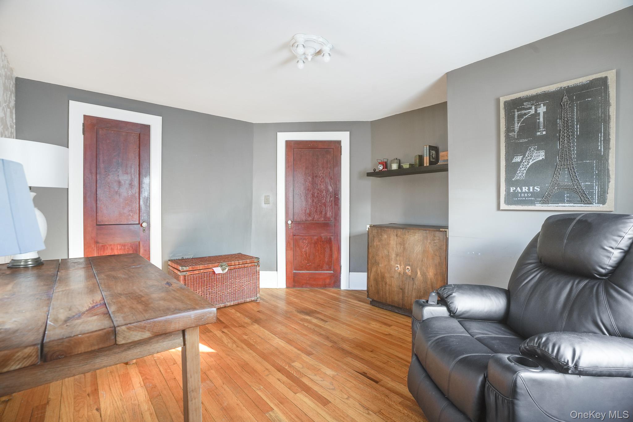31 Wilson Boulevard Poughkeepsie, NY 12603 - Photo 19 of 36 a living room with furniture and a wooden floor