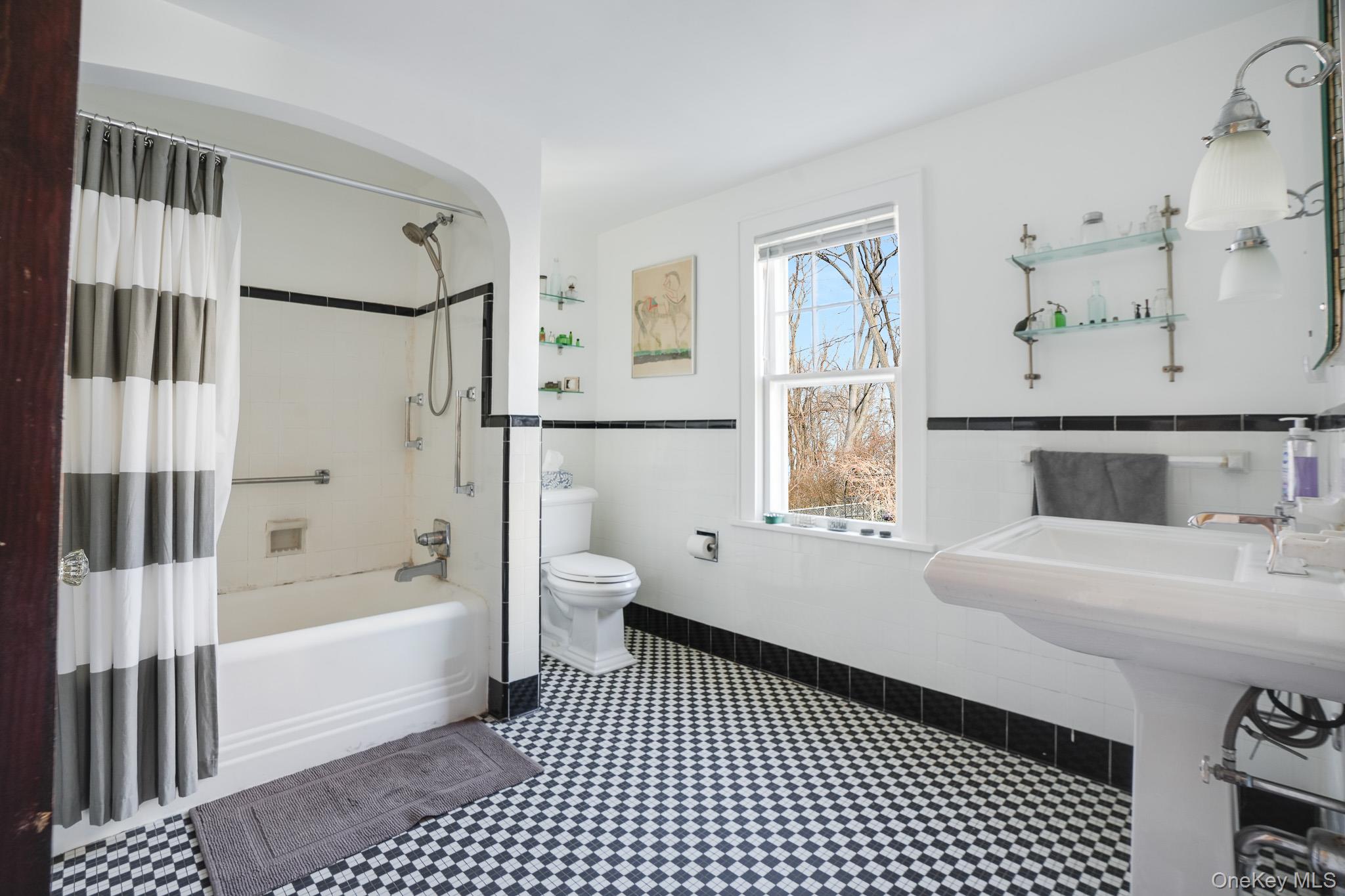 31 Wilson Boulevard Poughkeepsie, NY 12603 - Photo 20 of 36 a bathroom with a sink a toilet and shower