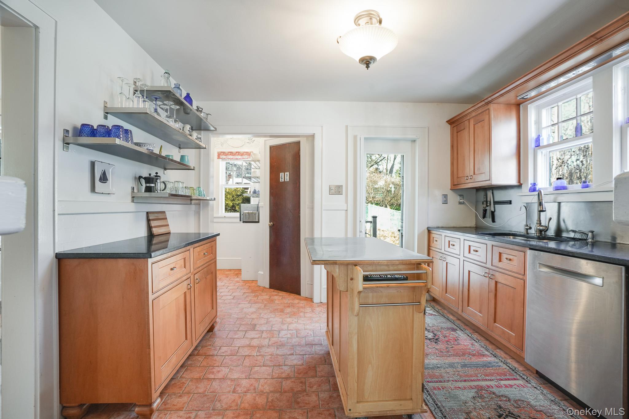 31 Wilson Boulevard Poughkeepsie, NY 12603 - Photo 9 of 36 a kitchen with stainless steel appliances granite countertop a sink stove and refrigerator