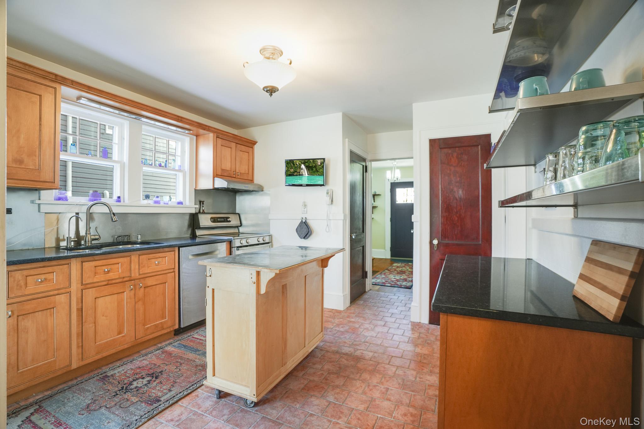 31 Wilson Boulevard Poughkeepsie, NY 12603 - Photo 10 of 36 a large kitchen with stainless steel appliances granite countertop a stove a sink and a refrigerator