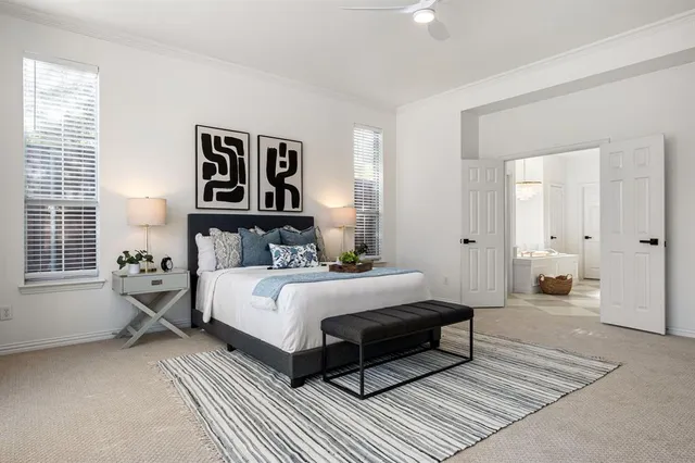 a spacious bedroom with a bed and a couch