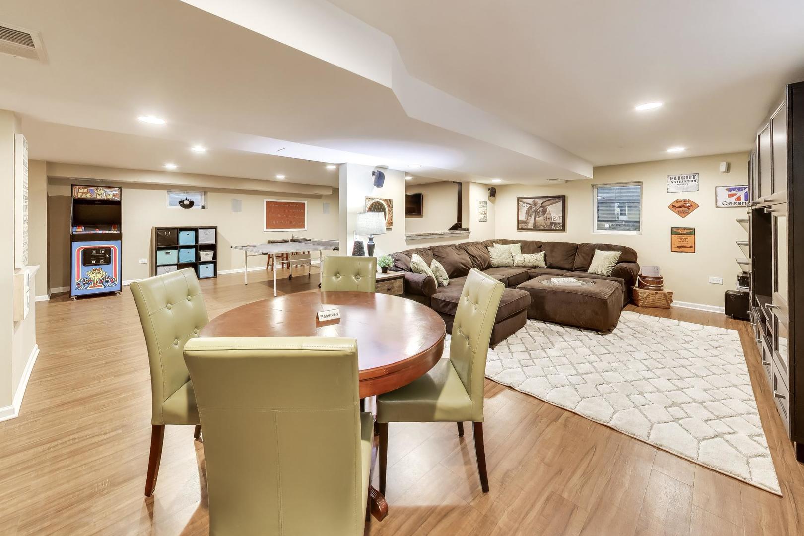 3956 Rutgers Lane Northbrook, IL 60062 - Photo 30 of 41 a living room with furniture a large window and a dining table