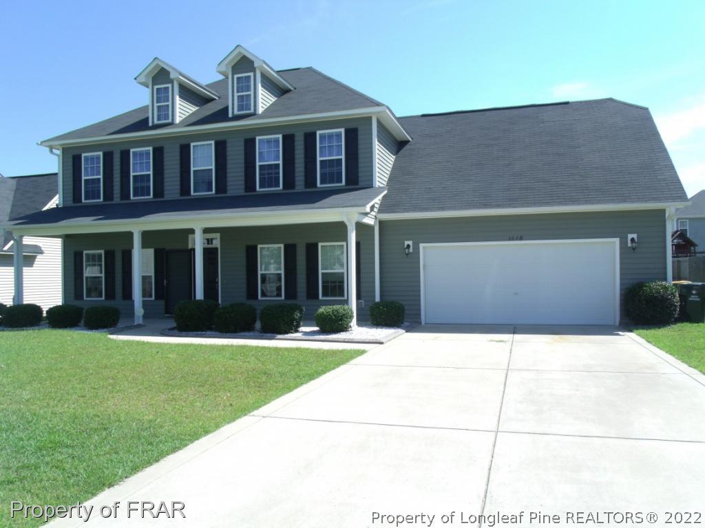 1448 Rough Rider Lane Parkton, NC 28371 - Photo 1 of 36 a front view of a house with a yard