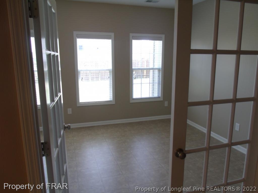 1448 Rough Rider Lane Parkton, NC 28371 - Photo 11 of 36 a view of an empty room with a window