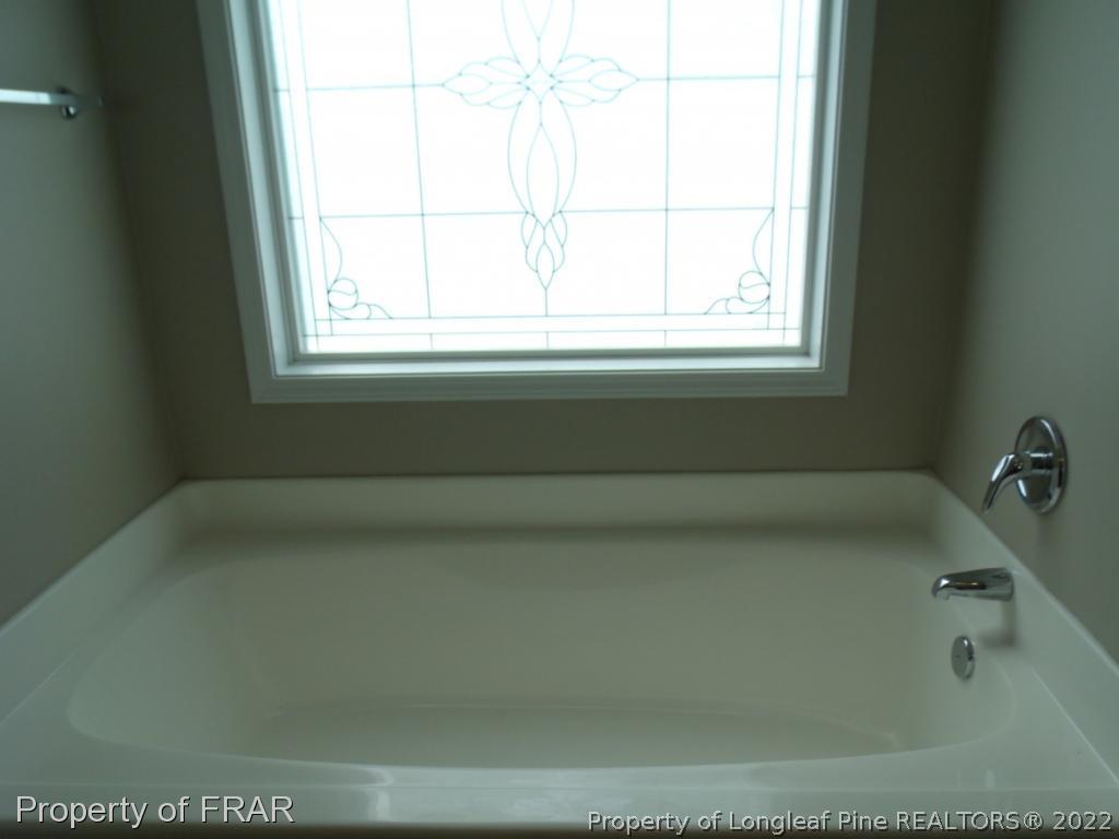 1448 Rough Rider Lane Parkton, NC 28371 - Photo 19 of 36 a bathroom with a bathtub