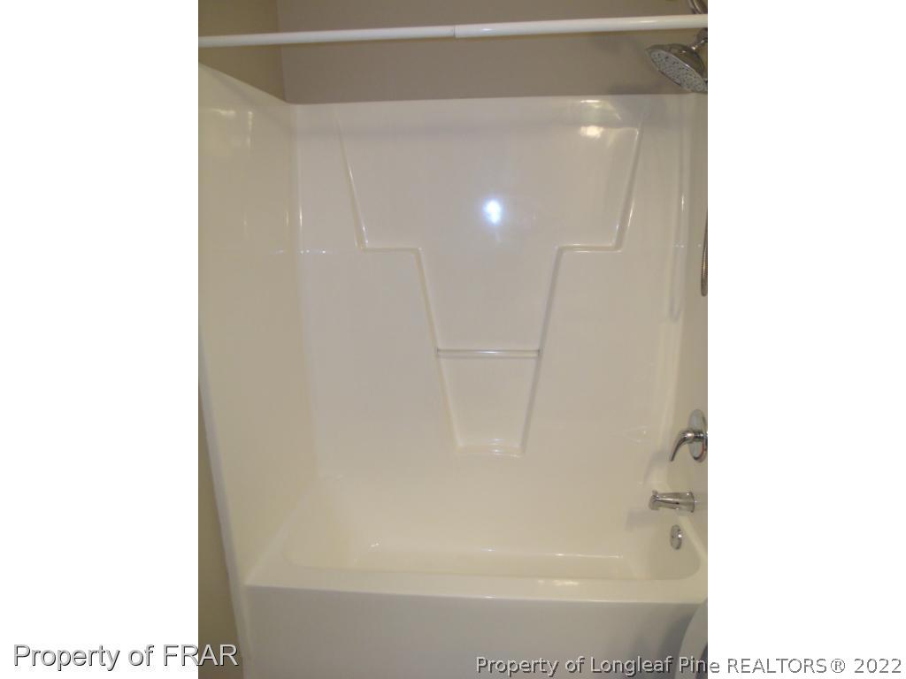 1448 Rough Rider Lane Parkton, NC 28371 - Photo 23 of 36 a bathroom with a shower