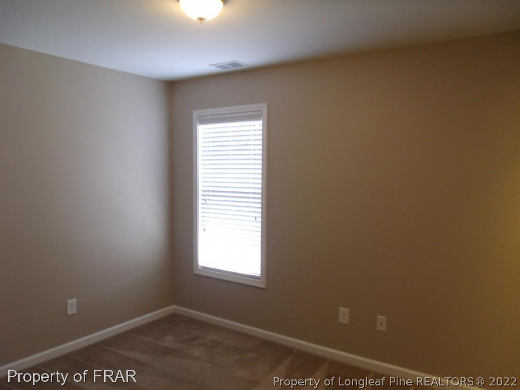 1448 Rough Rider Lane Parkton, NC 28371 - Photo 25 of 36 a view of an empty room with a window