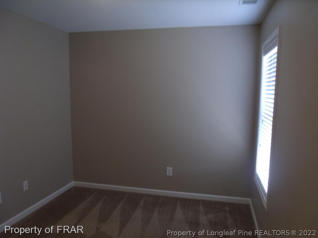 1448 Rough Rider Lane Parkton, NC 28371 - Photo 26 of 36 a view of an empty room and window