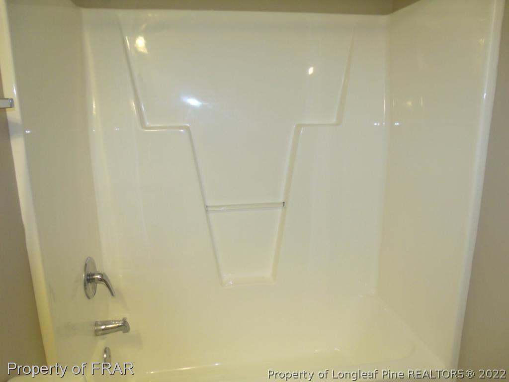 1448 Rough Rider Lane Parkton, NC 28371 - Photo 27 of 36 a bathroom with a shower
