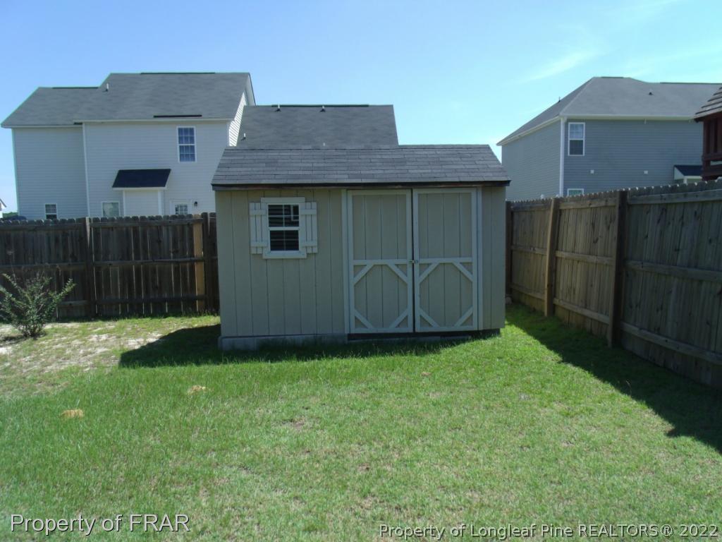 1448 Rough Rider Lane Parkton, NC 28371 - Photo 34 of 36 a house that has a backyard
