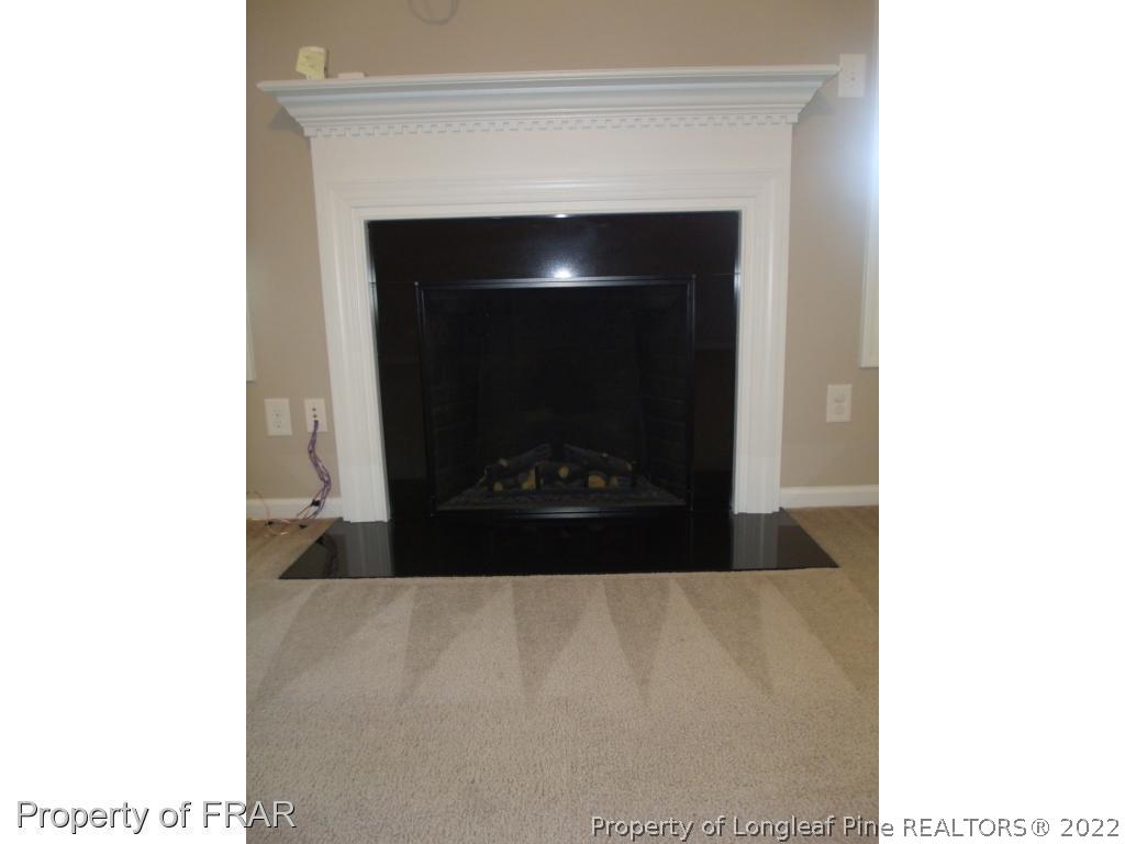 1448 Rough Rider Lane Parkton, NC 28371 - Photo 9 of 36 a living room with a fireplace