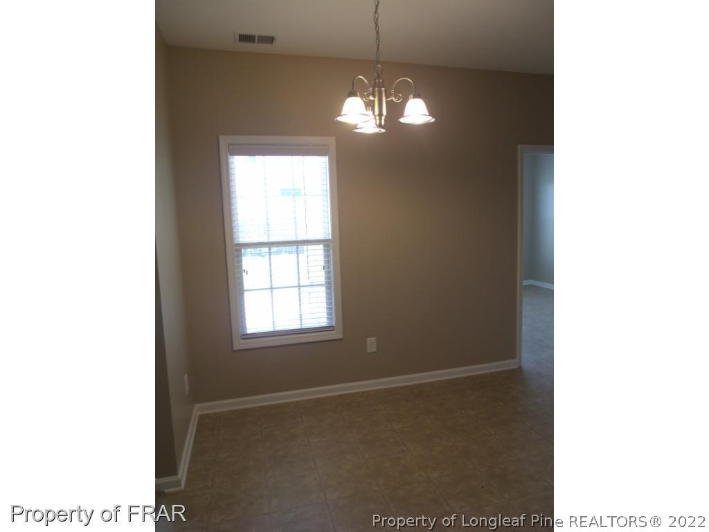 1448 Rough Rider Lane Parkton, NC 28371 - Photo 10 of 36 a view of a livingroom with a window