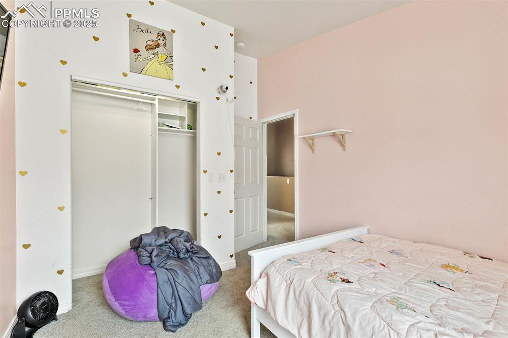 4573 Prestige Point Colorado Springs, CO 80906 - Photo 23 of 31 Carpeted bedroom featuring a closet