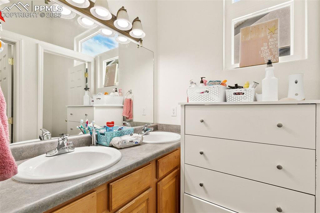 4573 Prestige Point Colorado Springs, CO 80906 - Photo 26 of 31 Bathroom with double vanity