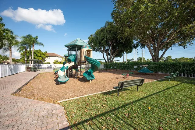 a view of a park with swings and slides