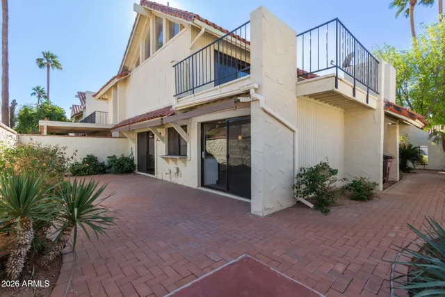 a front view of a house with a large window