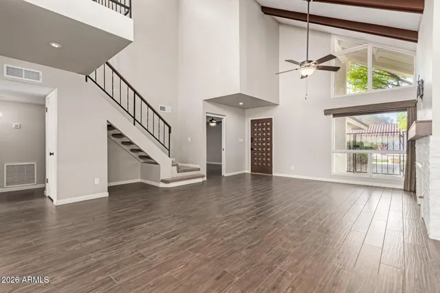 a view of an entryway with wooden floor