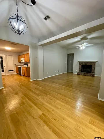 a view of a livingroom with wooden floor