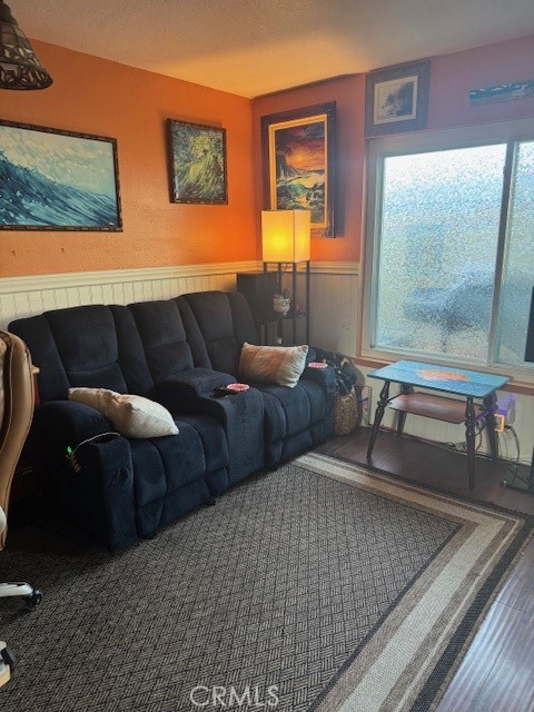 5246 St George Road Westminster, CA 92683 - Photo 12 of 16 a living room with furniture and a mirror