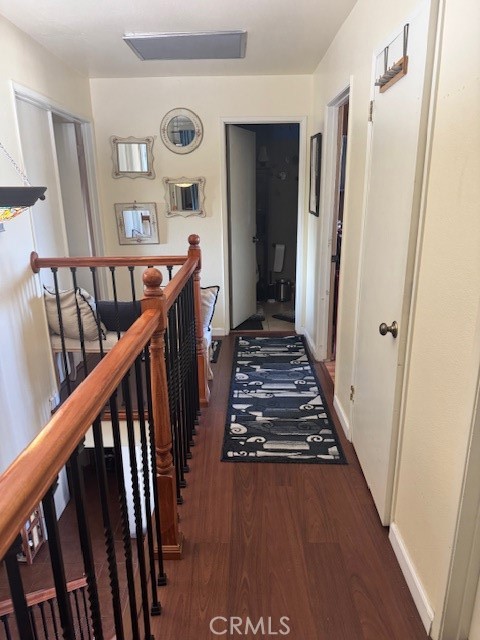 5246 St George Road Westminster, CA 92683 - Photo 8 of 16 a view of a hallway with wooden floor and stairs