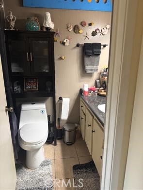 5246 St George Road Westminster, CA 92683 - Photo 9 of 16 a bathroom with a toilet and a sink