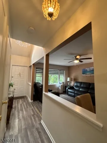 a view of a living room and dining room