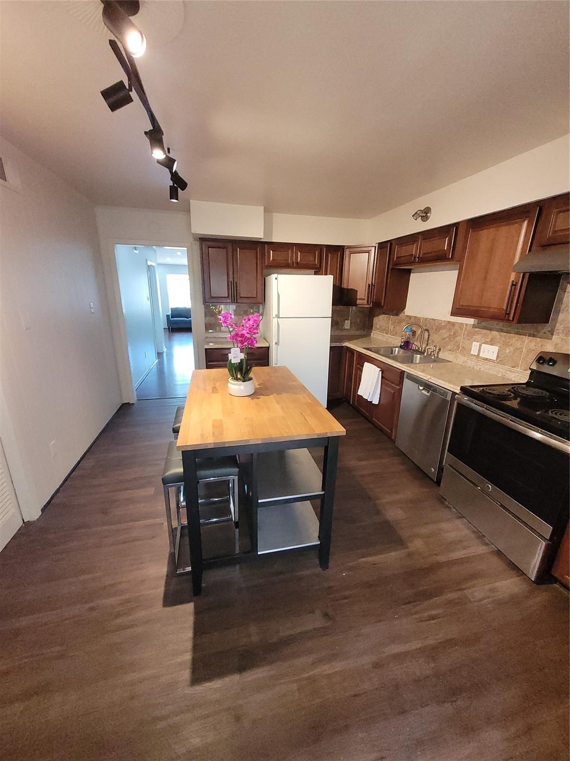 7213 Beechnut Street Houston, TX 77074 - Photo 10 of 12 a room with furniture and wooden floor