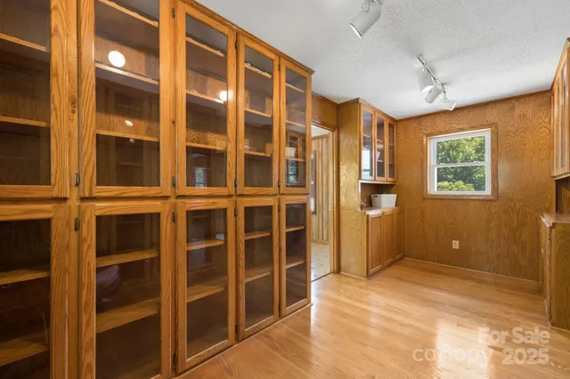 a spacious bedroom with a bed and a window