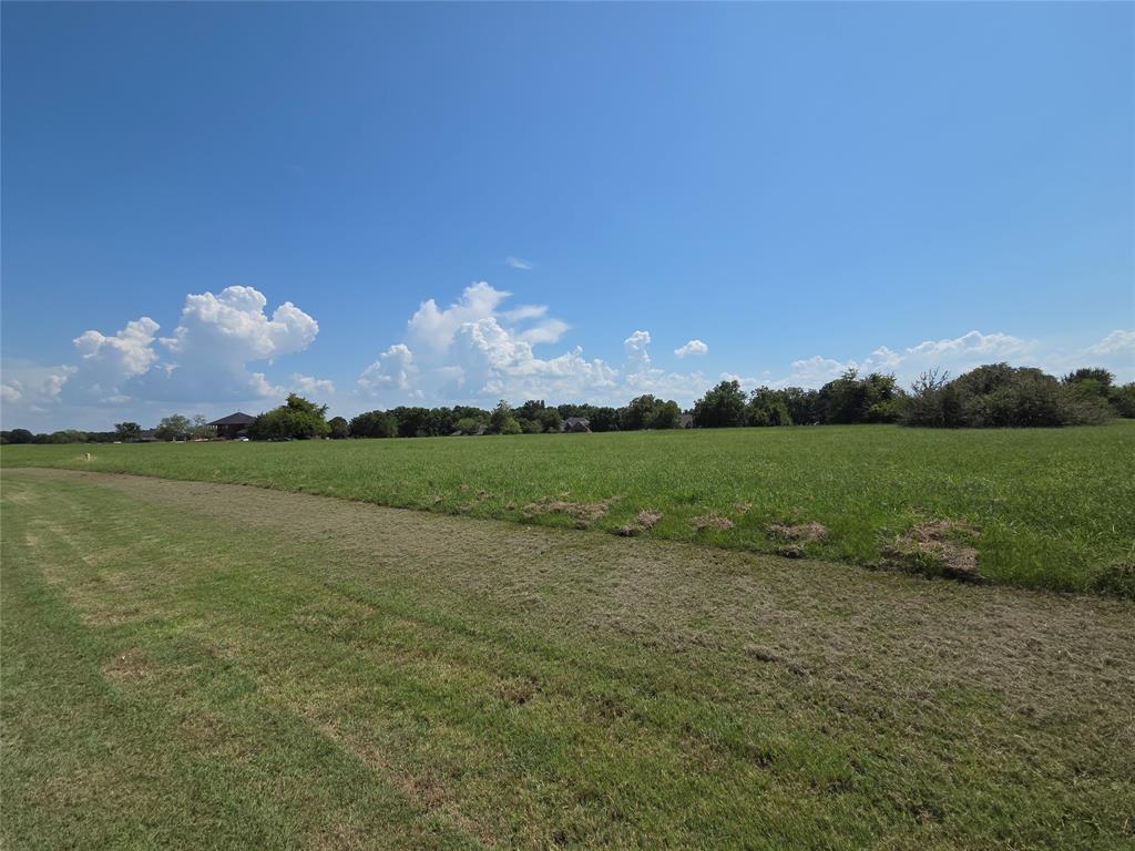 Lot 74 Tonkawa Trail Corsicana, TX 75109 - Photo 14 of 32 a view of a lake in middle of green field