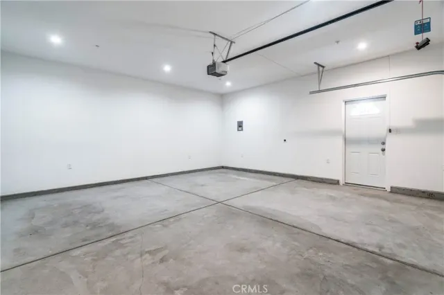 a living room with furniture a chandelier and a chandelier