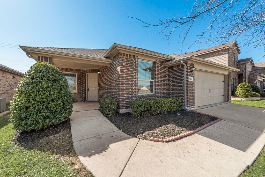 5117 Grayson Ridge Drive Fort Worth, TX 76179 - Photo 2 of 31 Single story home with brick siding, a garage, walkway and driveway and covered front porch