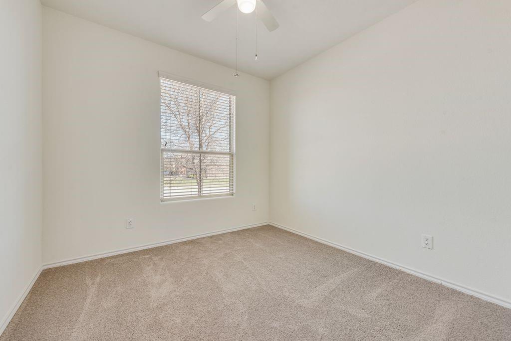 5117 Grayson Ridge Drive Fort Worth, TX 76179 - Photo 28 of 36 an empty room with a window