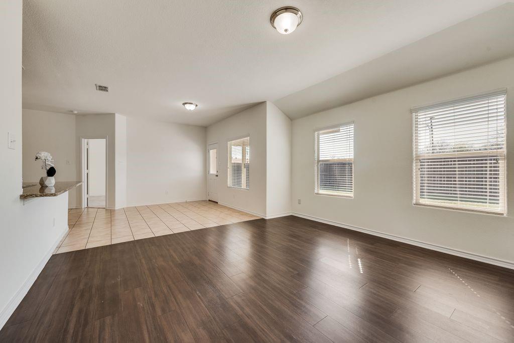 5117 Grayson Ridge Drive Fort Worth, TX 76179 - Photo 7 of 31 Empty room featuring light wood-type flooring and baseboards
