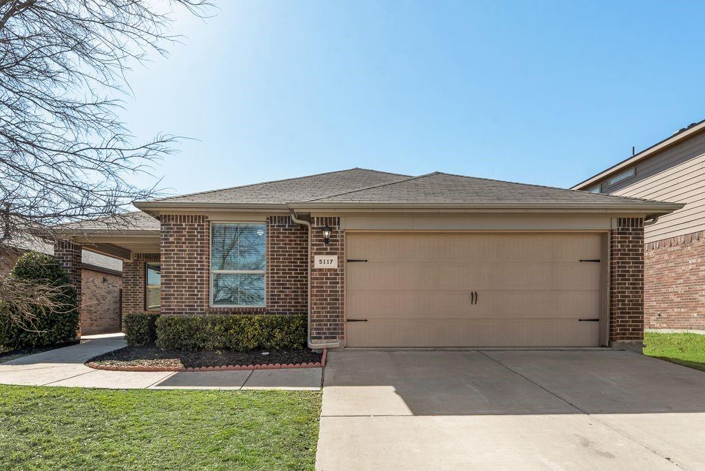 5117 Grayson Ridge Drive Fort Worth, TX 76179 - Photo 9 of 36 front view of a house with a yard