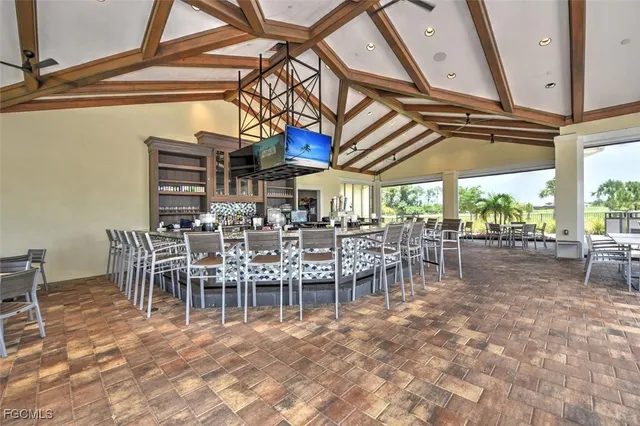 a view of a dining room with furniture window and outside view