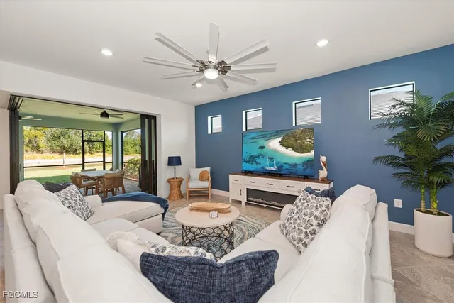 a living room with furniture and a large window
