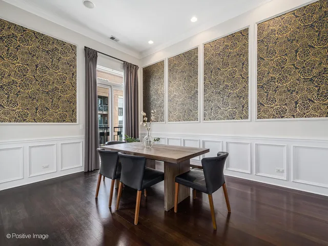 a view of a dining room with furniture and window