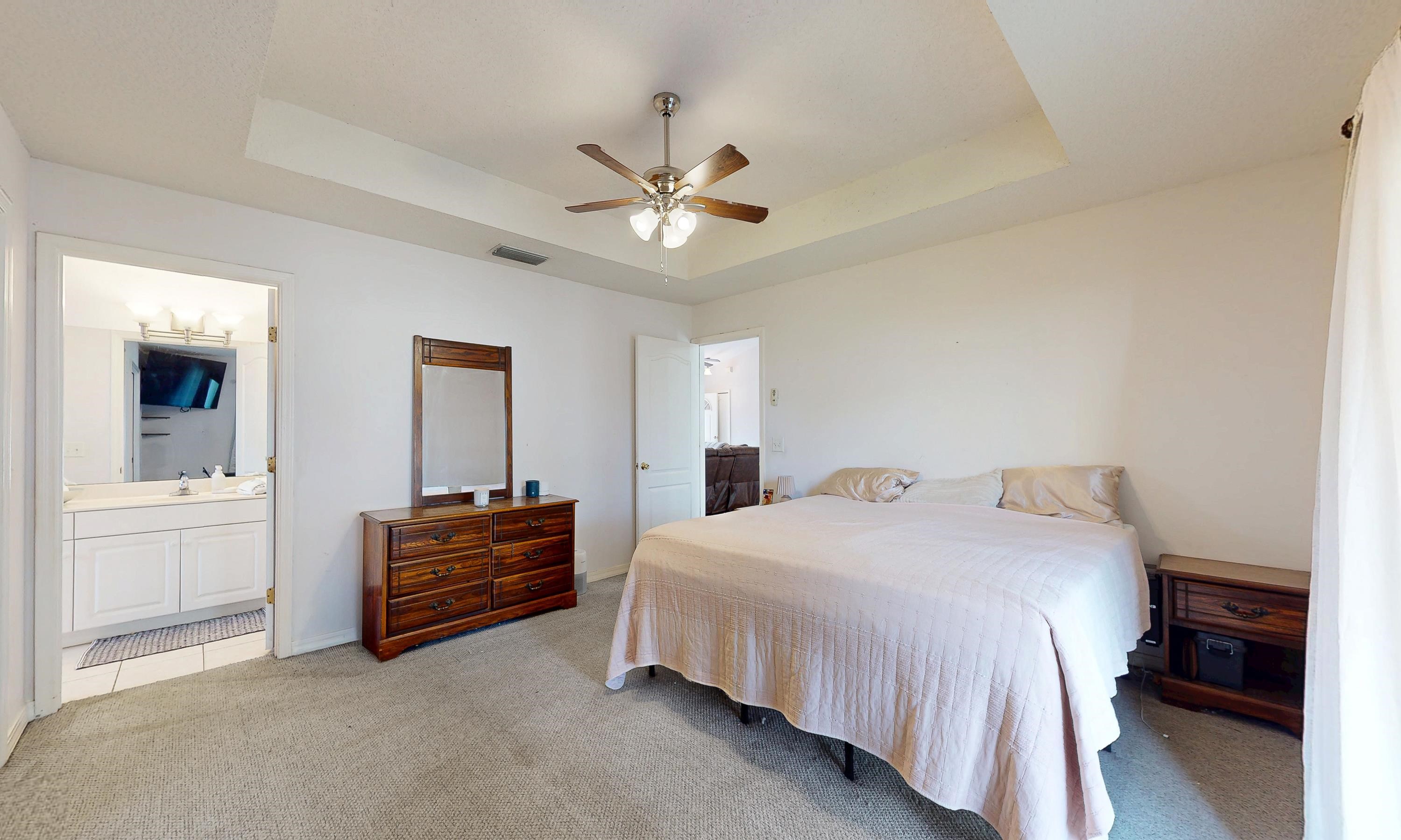 330 Segovia Road St. Augustine, FL 32086 - Photo 13 of 52 a bedroom with a bed and a chandelier