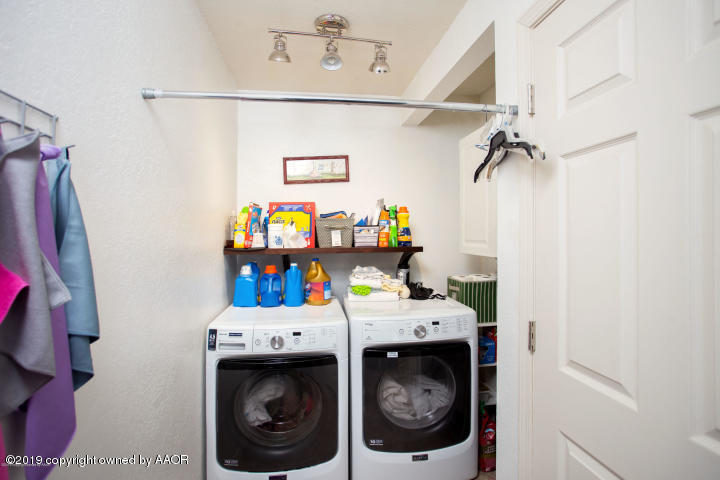 4013 South Travis Street Amarillo, TX 79110 - Photo 16 of 40 a utility room with dryer and washer