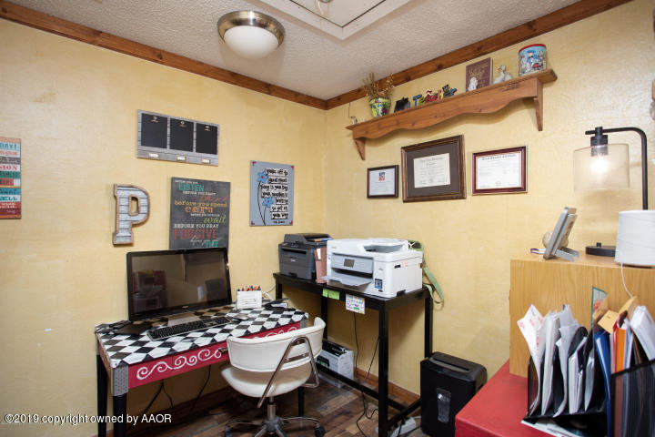 4013 South Travis Street Amarillo, TX 79110 - Photo 21 of 40 a reading room with furniture and wooden floor